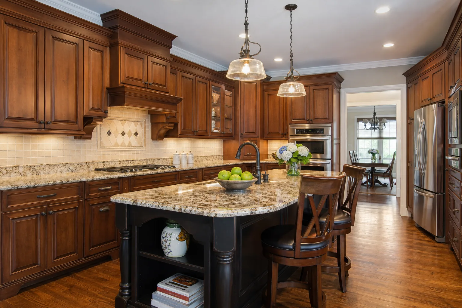 Traditional kitchen renovation with raised-panel cabinets, crown molding, and granite counters